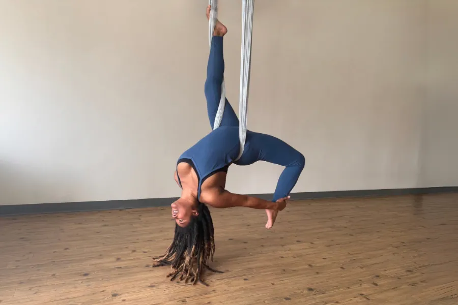 An inverted pose in the aerial silks